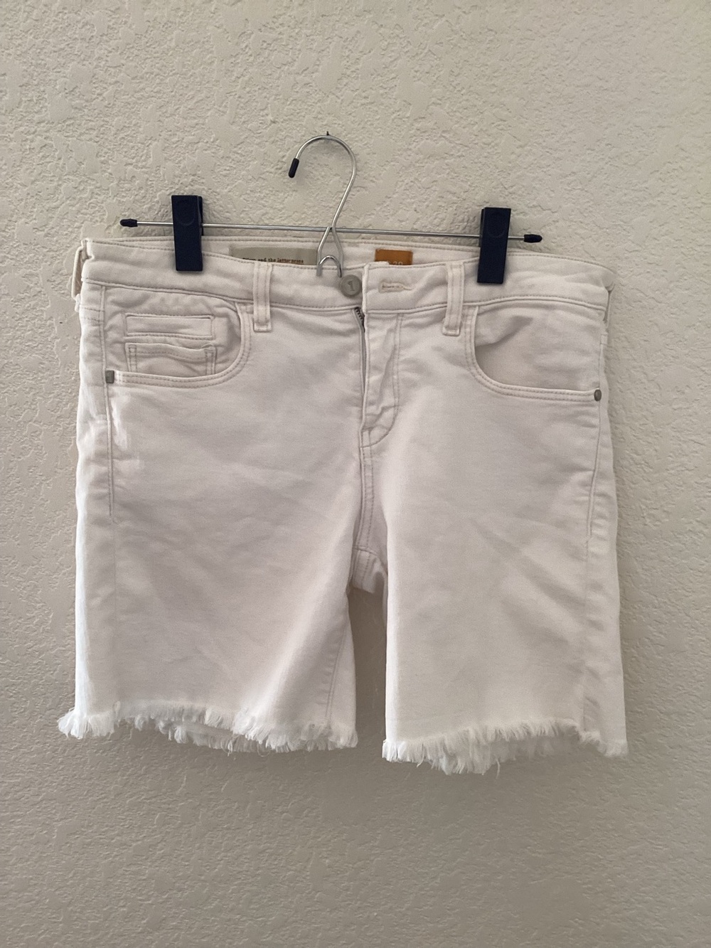 Pilcro & the Letterpress stretch denim cutoff shorts featuring a raw, frayed hem